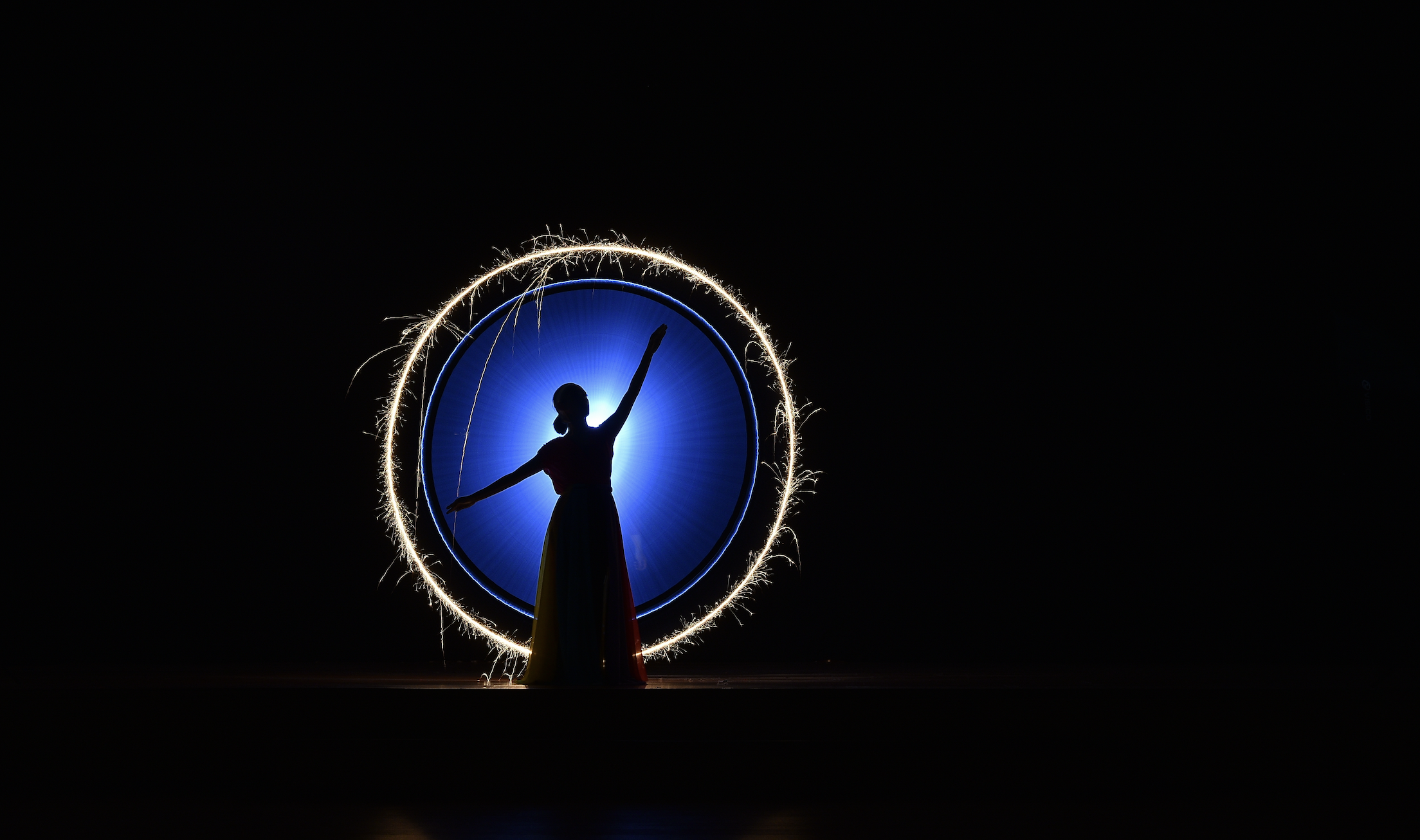 woman dancing on a dark stage
